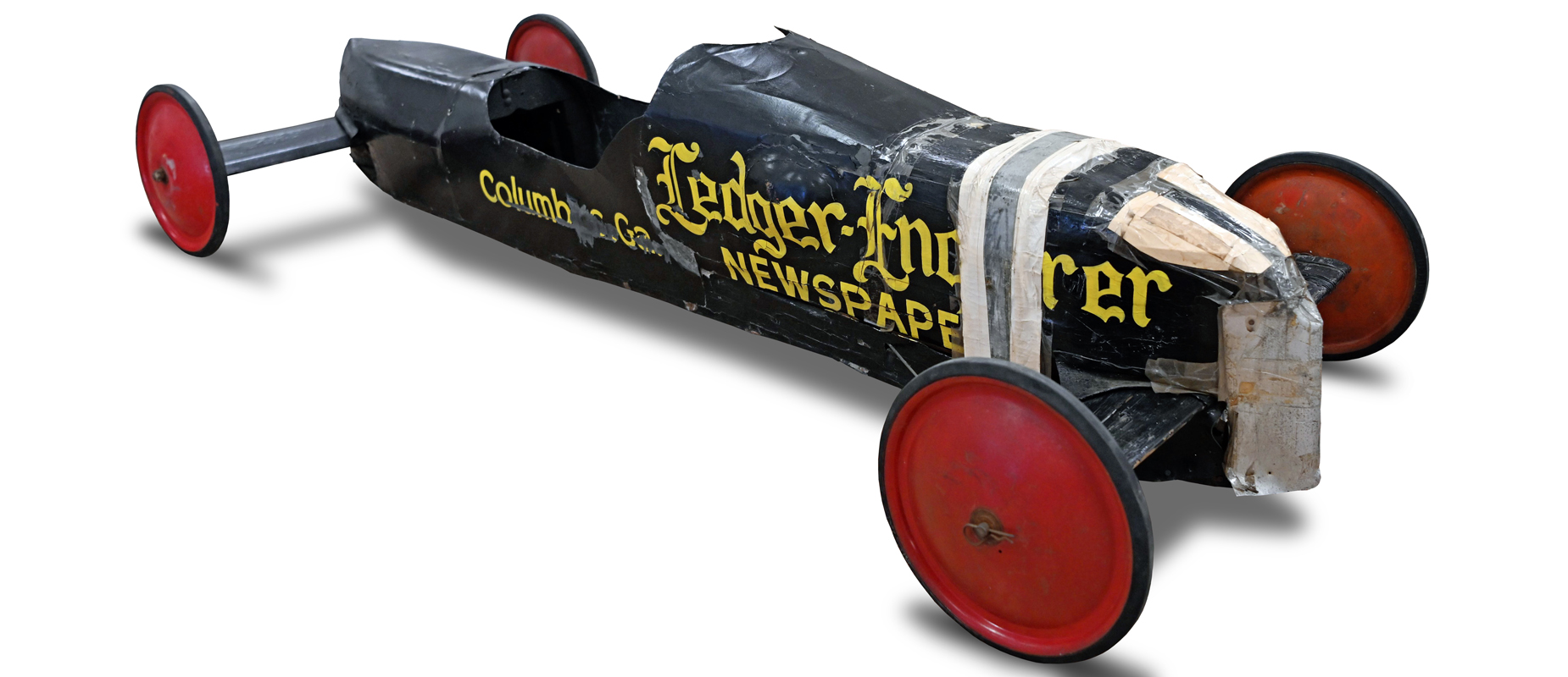 Joe Lunn's black and yellow 1952 championship Soap Box Derby car preserved with its damaged and repaired nose visible